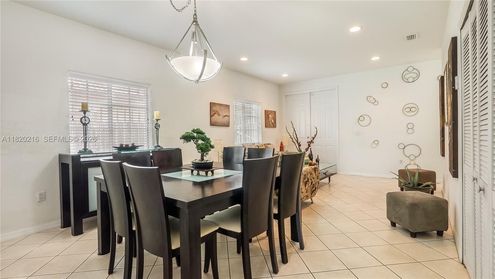 19730 Northwest 78th Avenue Hialeah, FL 33015 - Photo 5 of 30 a view of a dining room with furniture