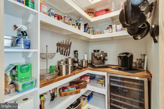 a dining room with furniture window and wooden floor