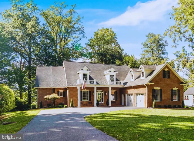 a living room with fireplace furniture and a flat screen tv