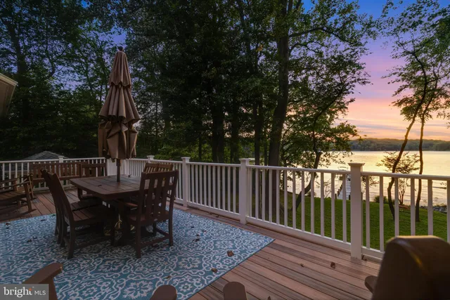 a living room with furniture a rug and a large window