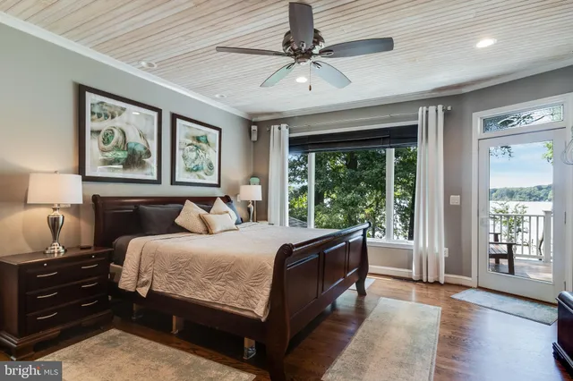 a bed room with a bed and a large window