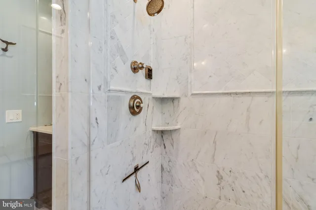 a view of a lake with a table and chairs next to a yard