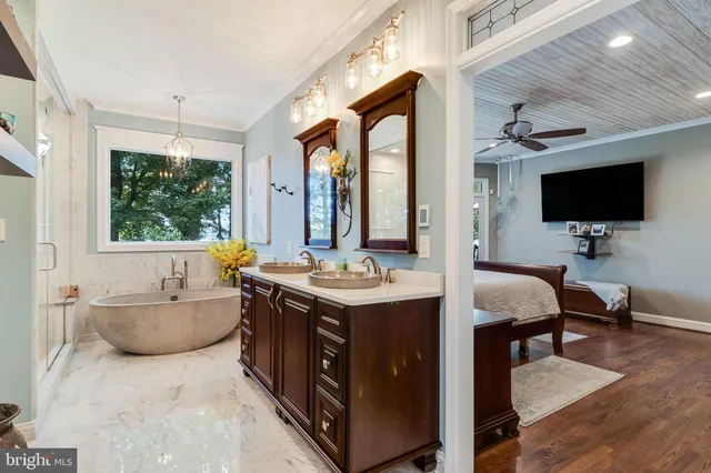 a view of a room with wooden floor and windows