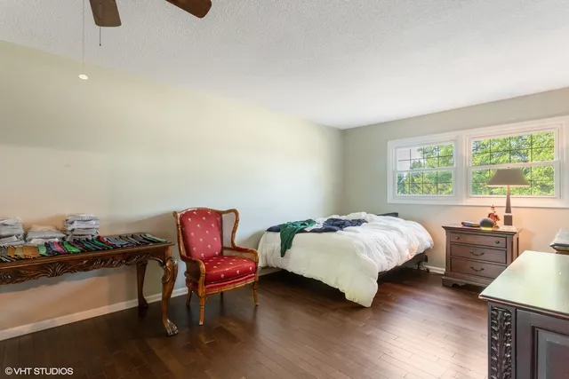 a bedroom with bed and a window