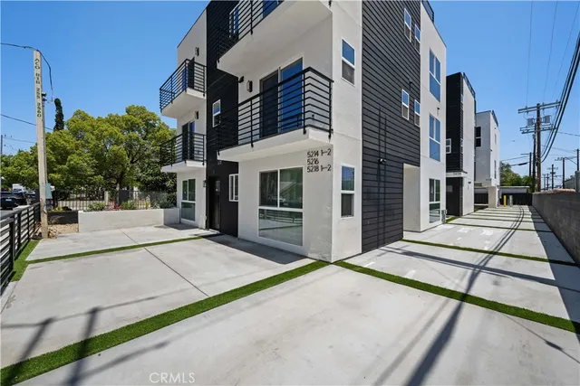 a view of a street with sitting area