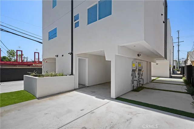 a white toilet sitting next to a bath tub