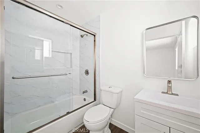 a bathroom with a sink a mirror and a shower