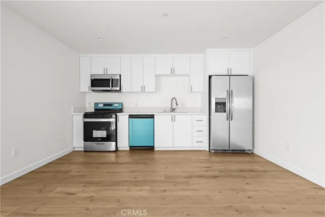 a bathroom with a shower a toilet and a sink