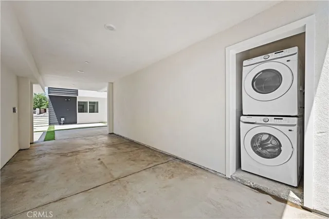 a kitchen with stainless steel appliances a refrigerator sink and cabinets