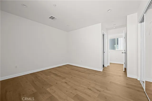 a view of a room with wooden floor and sink