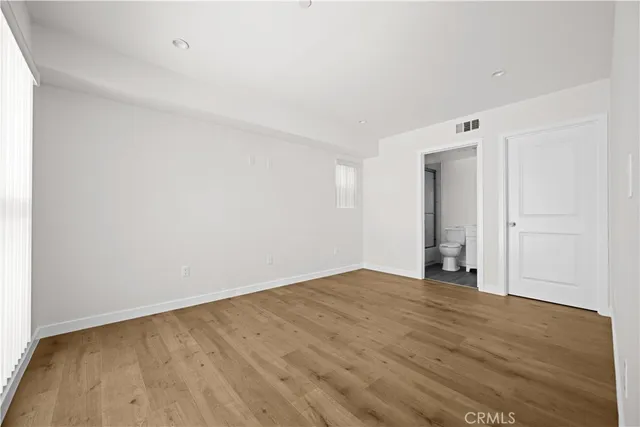 a kitchen with stainless steel appliances a stove refrigerator sink and microwave