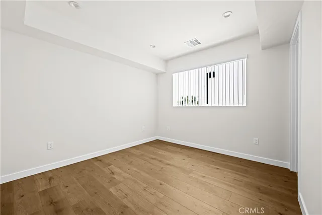 a bathroom with a shower a sink a toilet and a mirror