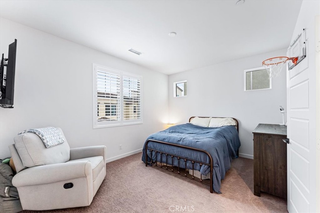 511 Sparrowhawk Way Rancho Mission Viejo, CA 92694 - Photo 15 of 29 a bedroom with a bed and a couch