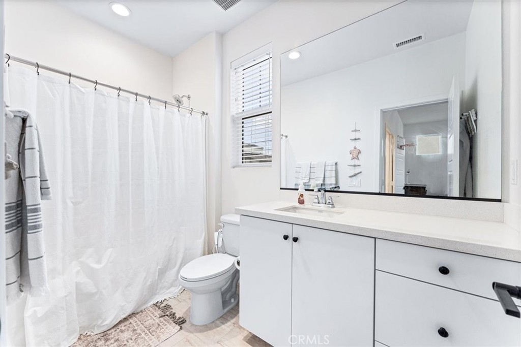 511 Sparrowhawk Way Rancho Mission Viejo, CA 92694 - Photo 17 of 29 a bathroom with a toilet a sink and a mirror