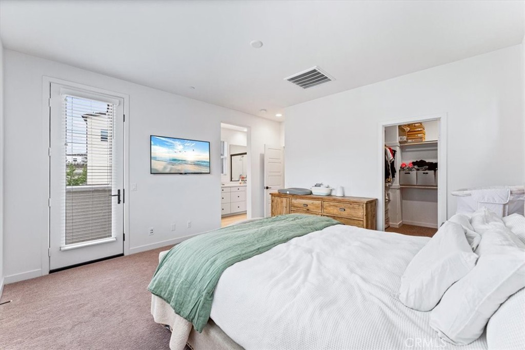 511 Sparrowhawk Way Rancho Mission Viejo, CA 92694 - Photo 21 of 29 a spacious bedroom with a bed and a refrigerator