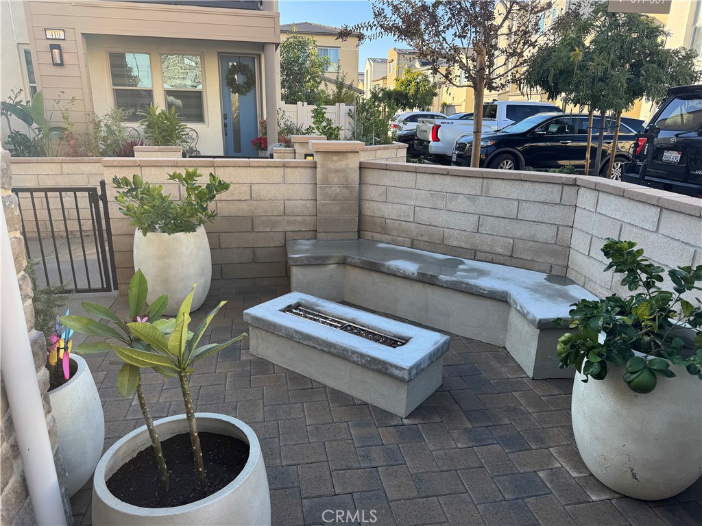 511 Sparrowhawk Way Rancho Mission Viejo, CA 92694 - Photo 3 of 29 a view of a patio with table and chairs potted plants