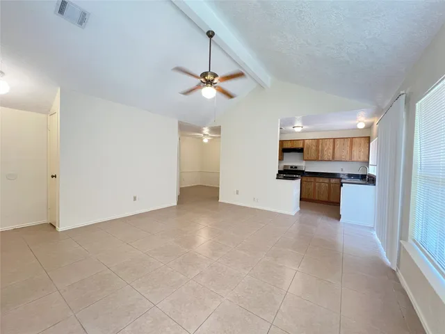 a view of a kitchen with a sink and cabinet window