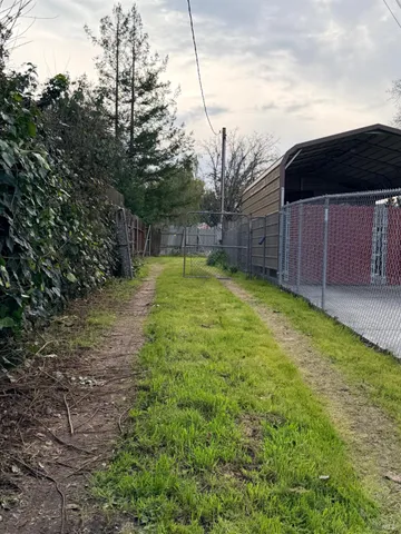 a view of a backyard with potted plants