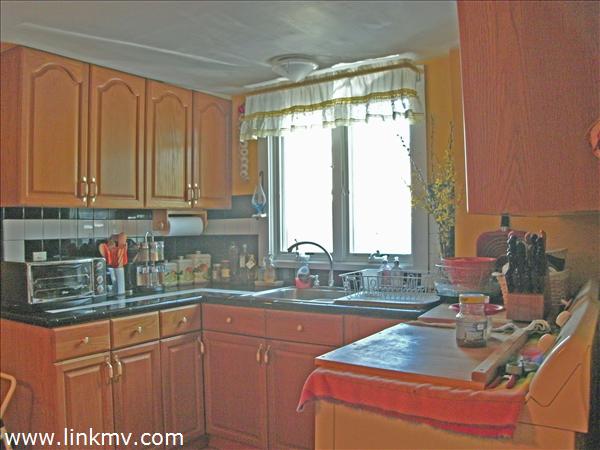 29 Chase Road Edgartown, MA 02539 - Photo 5 of 6 a kitchen with sink and large window