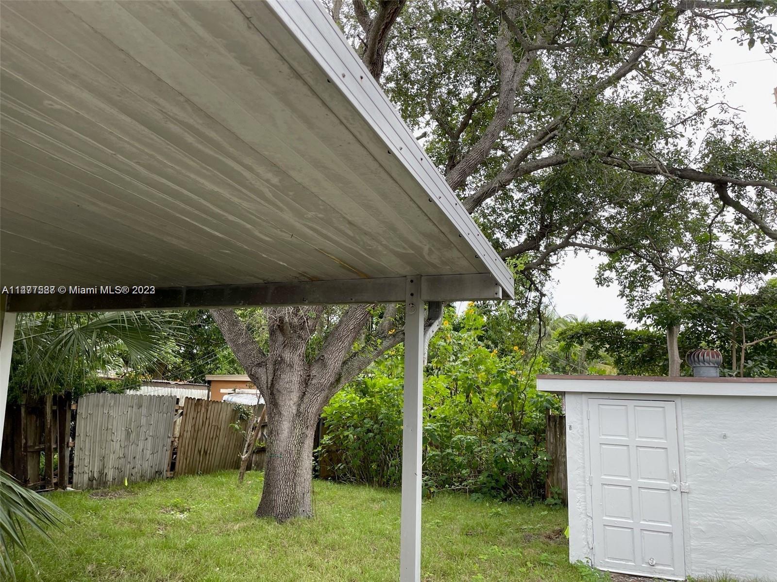 3275 Grove Road Boynton Beach, FL 33435 - Photo 3 of 3 a backyard of a house with lots of green space