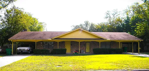 a view of a house with swimming pool and a yard