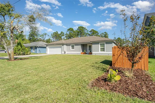 a house view with a garden space