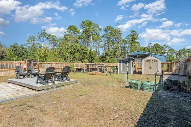 a view of a patio with a table and chairs