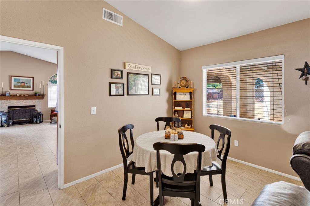 20403 Ochoa Road Apple Valley, CA 92307 - Photo 19 of 48 a view of a dining room with furniture and a window