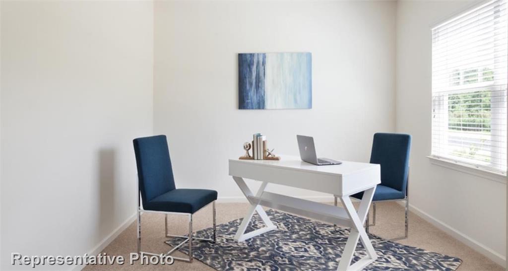 1409 Kennedy Road Howe, TX 75459 - Photo 3 of 6 a work room with a desk and chair