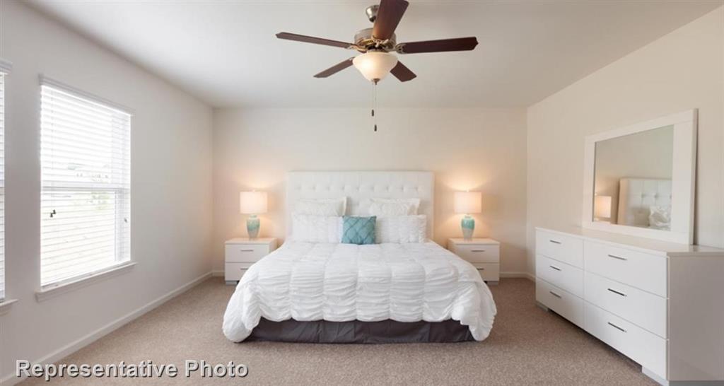 1409 Kennedy Road Howe, TX 75459 - Photo 5 of 6 a bedroom with a large bed and a chandelier fan