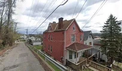 a house with trees in front of it