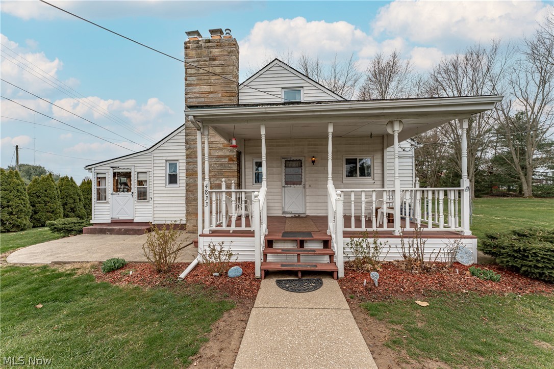 4833 Angling Road Wooster, OH 44691 - Photo 1 of 49 Bungalow-style house featuring a front lawn and a porch