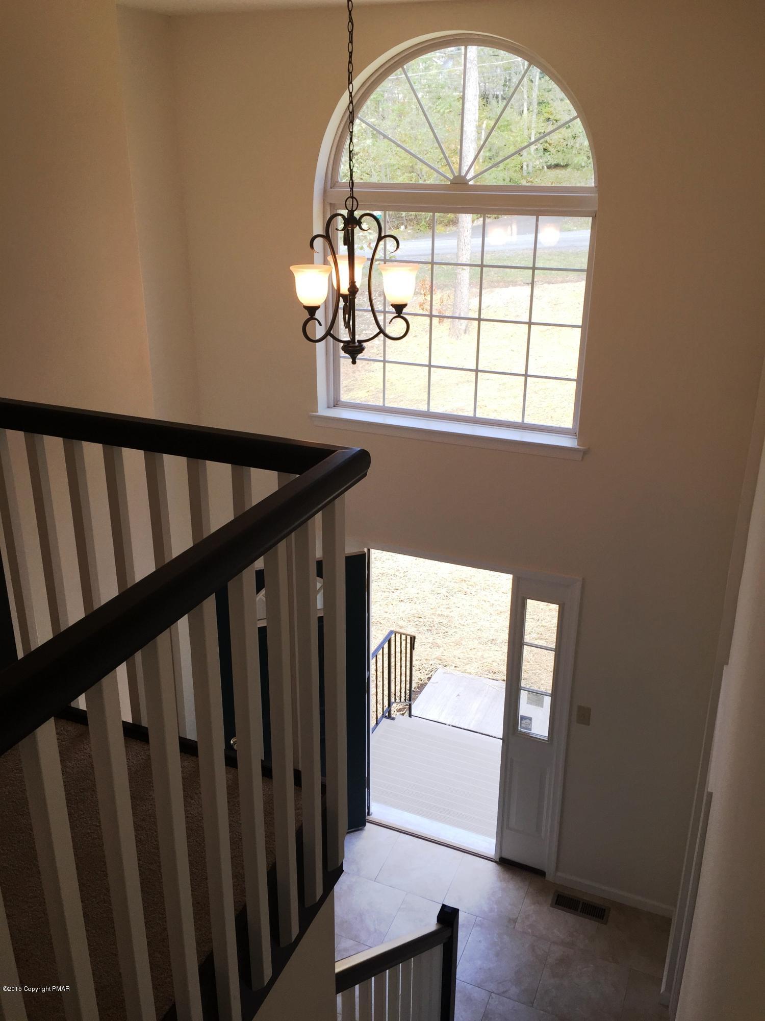 168 Whitetail Road Henryville, PA 18332 - Photo 15 of 28 a view of staircase with wooden floor and a window