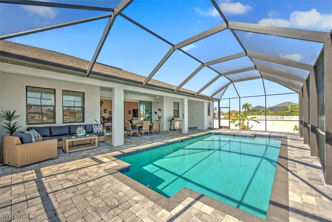 a view of a house with backyard porch and sitting area