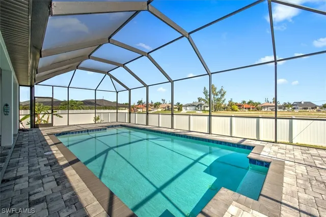 a view of a balcony with a floor to ceiling window next to a yard