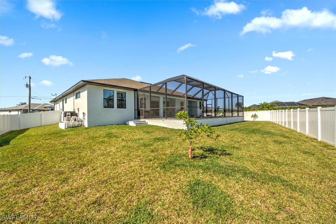 3527 Southwest 4th Lane Cape Coral, FL 33991 - Photo 17 of 18 a view of a house with a yard