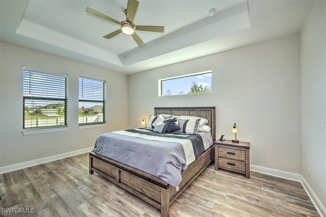 3527 Southwest 4th Lane Cape Coral, FL 33991 - Photo 8 of 18 a bedroom with a bed and a window