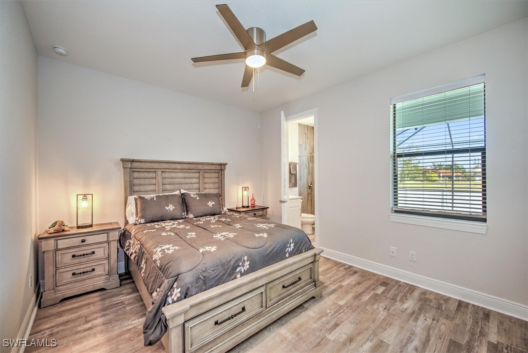 3527 Southwest 4th Lane Cape Coral, FL 33991 - Photo 10 of 18 a bed sitting in a bedroom next to a window