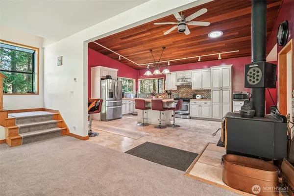 a view of living room with furniture and a chandelier