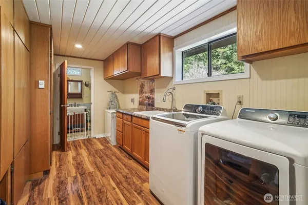 a kitchen with a stove a sink and a refrigerator