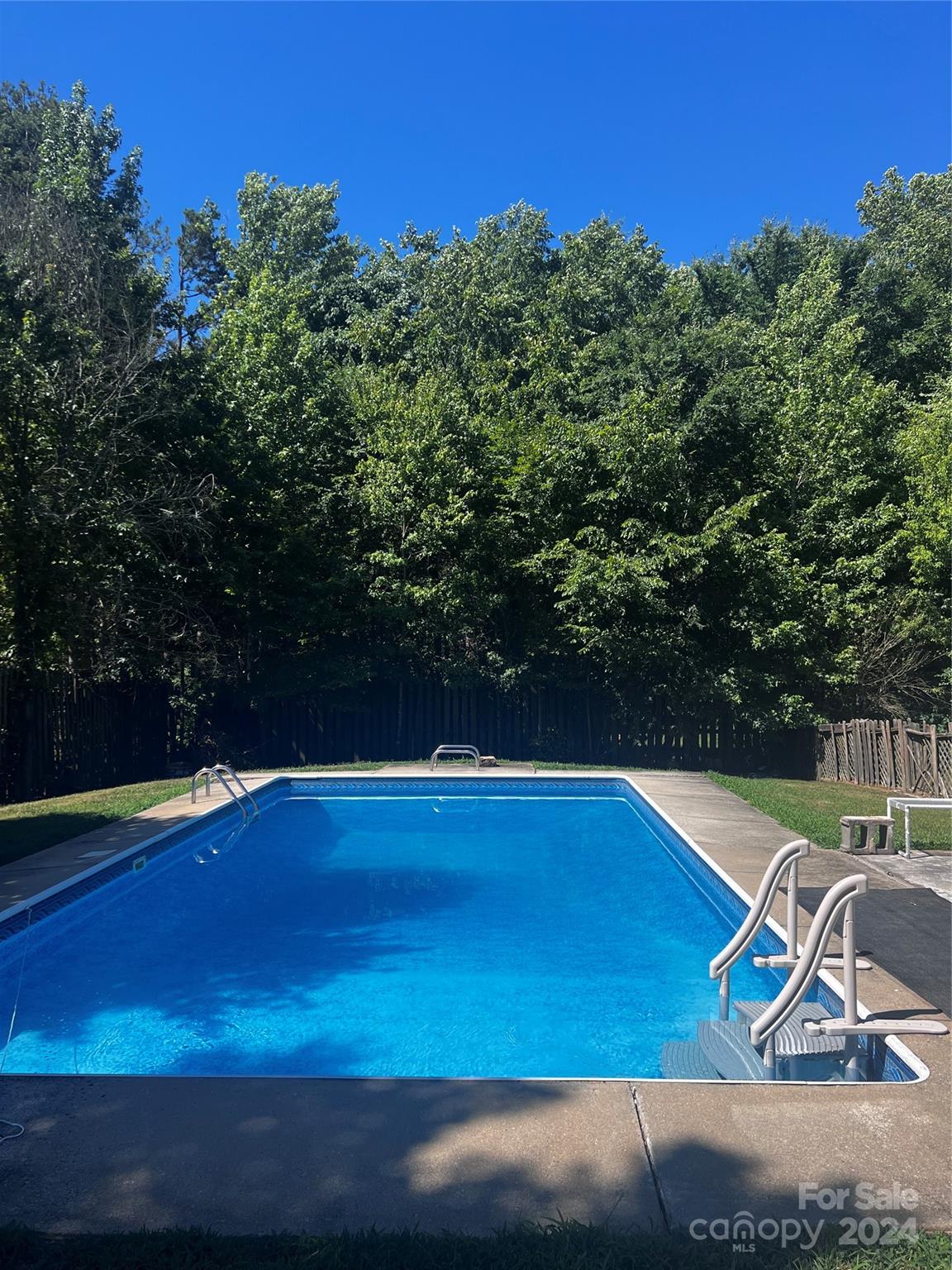655 Lippard Road Salisbury, NC 28146 - Photo 2 of 18 a view of a swimming pool with an outdoor space and seating area