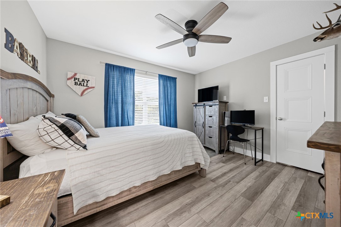 28099 Fm 2670 Killeen, TX 76549 - Photo 26 of 48 a bedroom with a bed and a chandelier