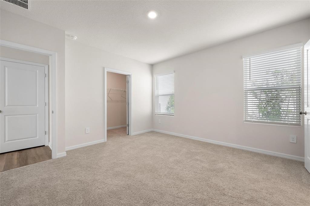 3218 Bitterroot Lane Bradenton, FL 34211 - Photo 15 of 48 an empty room with windows