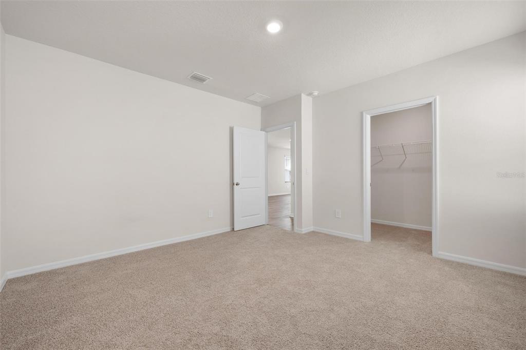 3218 Bitterroot Lane Bradenton, FL 34211 - Photo 16 of 48 an empty room with an entryway