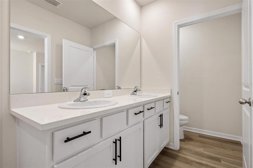 3218 Bitterroot Lane Bradenton, FL 34211 - Photo 17 of 48 a bathroom with a sink and a mirror