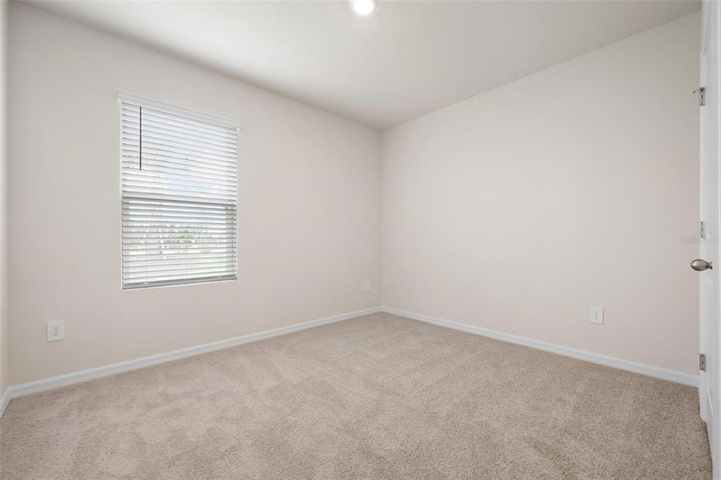 3218 Bitterroot Lane Bradenton, FL 34211 - Photo 23 of 48 an empty room with a window