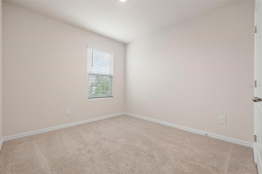 3218 Bitterroot Lane Bradenton, FL 34211 - Photo 25 of 48 an empty room with a window