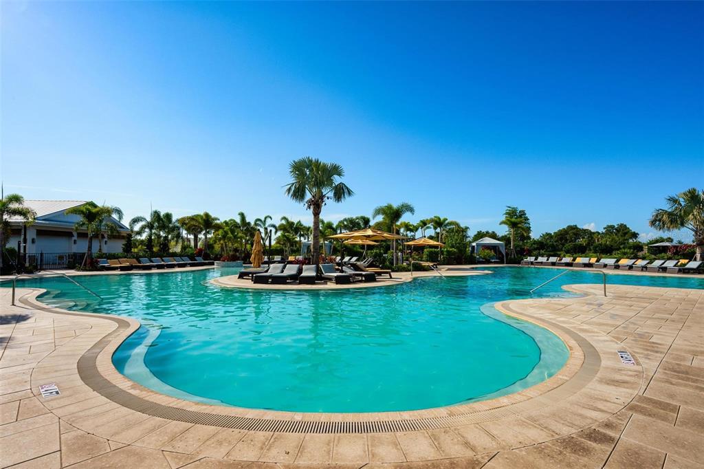 3218 Bitterroot Lane Bradenton, FL 34211 - Photo 45 of 48 a view of a swimming pool and lounge chairs