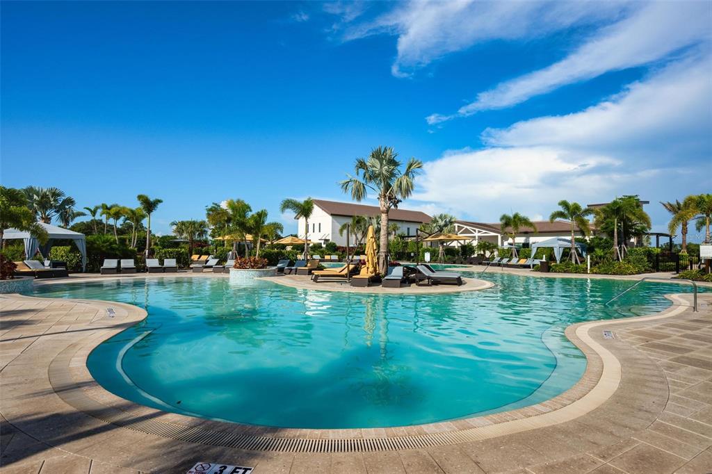 3218 Bitterroot Lane Bradenton, FL 34211 - Photo 46 of 48 a view of a swimming pool with a garden