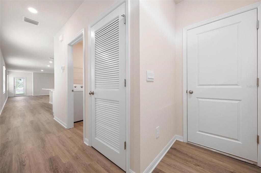 3218 Bitterroot Lane Bradenton, FL 34211 - Photo 9 of 48 a view of a hallway with wooden floor